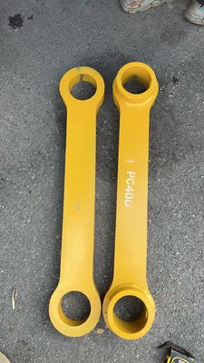 L'excavatrice jaune à trois pièces, traitée à la chaleur, lisse
